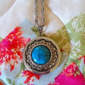 Beautiful silver locket with faux Turquoise stone.